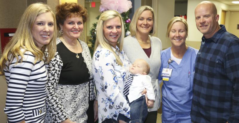 Baby Easton’s “caring village” at Beebe Healthcare includes (l-r) Dr. Erin Fletcher, board certified in pediatrics; Karen Smail, neonatal nurse practitioner; beaming mom Michelle Schaffer, CAT Scan tech, with napping son Easton; Gretchen Hegwood and Candace Thune, registered nurses; and very proud dad, Phil Falgowski, CAT Scan tech. SUBMITTED PHOTO